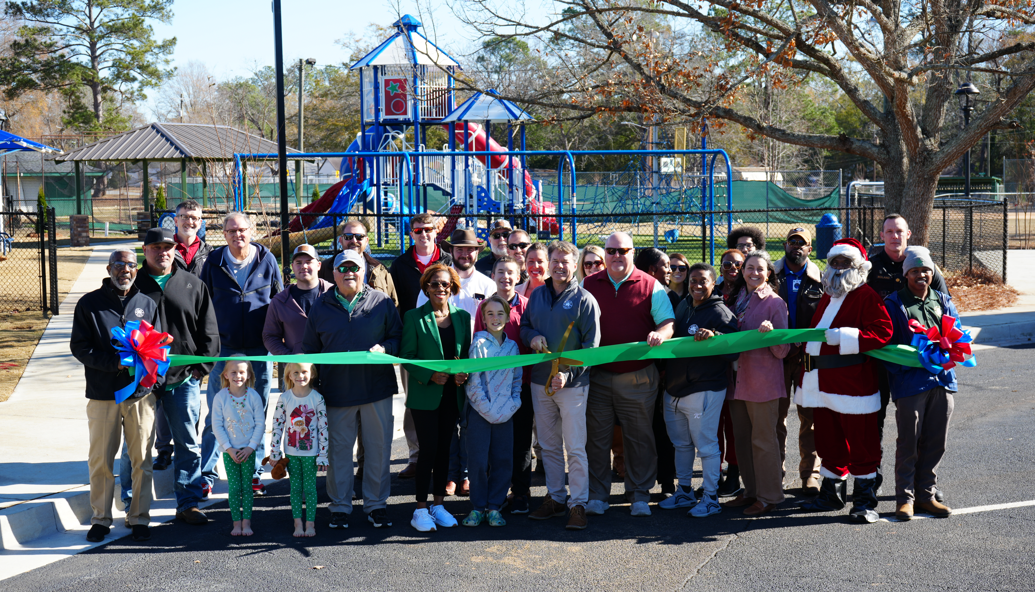 Group standing with ribbon